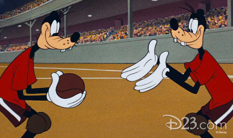 A still from Double Dribble shows two of the Goofy look-alikes, with one holding a basketball, with the other Goofy requesting it.