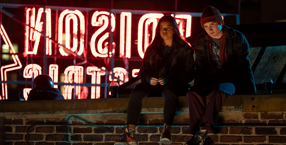 Iman Vellani as Kamala Khan sits with her bestie Bruno, played by Matt Lintz, on the rooftop of Circle Q one late evening