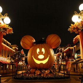 A larger than life Mickey shaped Jack-O-Lantern sits at the top of an empty Main Street, U.S.A. at Disneyland Park.