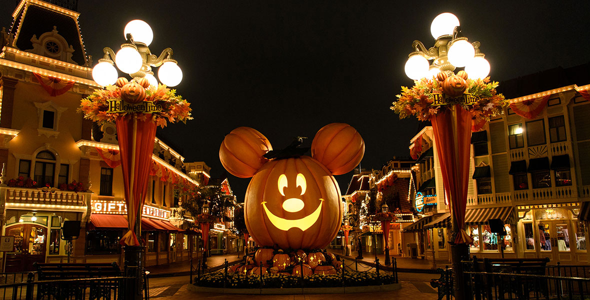A larger than life Mickey shaped Jack-O-Lantern sits at the top of an empty Main Street, U.S.A. at Disneyland Park.