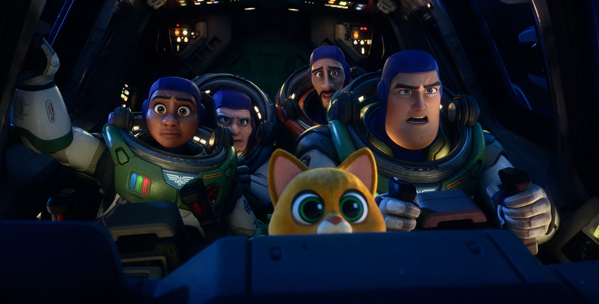 In a still from Disney and Pixar&rsquo;s Lightyear, Izzy, Darby, Mo, Buzz, and Sox are in the cockpit of a spaceship. The humans are wearing spacesuits; all look concerned. Knobs and buttons are lit up around them.