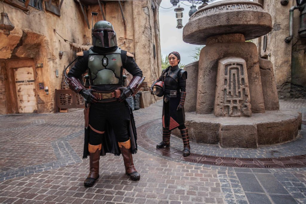 At Star Wars: Galaxy’s Edge at Disneyland Park in Anaheim, Calif., guests exploring the outskirts of Black Spire Outpost may encounter the legendary bounty hunter Boba Fett or the highly skilled mercenary Fennec Shand, as they attempt to remain in the shadows on the planet Batuu. (Sean Teegarden/Disneyland Resort)