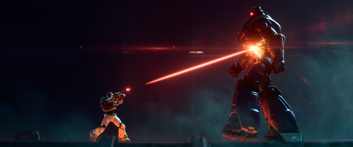 Buzz, wearing his Space Ranger spacesuit, is shooting a fiery laser beam up at the imposing Zurg, a huge robot with glowing red eyes, in a still from Disney and Pixar’s Lightyear.