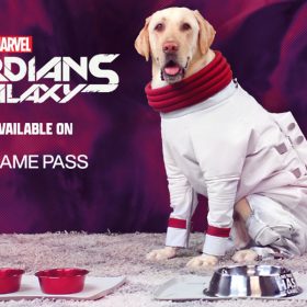 Milo the golden retriever sits attentively on a gray carpet wearing a white spacesuit with red trim around his paws and puffy red trim around his neck. In front of him are two red dog bowls and one large silver bowl. To his left is the Marvel Guardians of the Galaxy logo and the text “Now Available on PC Game Pass.”