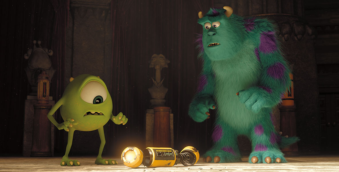 (L-R) Animated monsters Mike Wazowski and Sulley stand over a yellow scare cannister with their jaws agape.