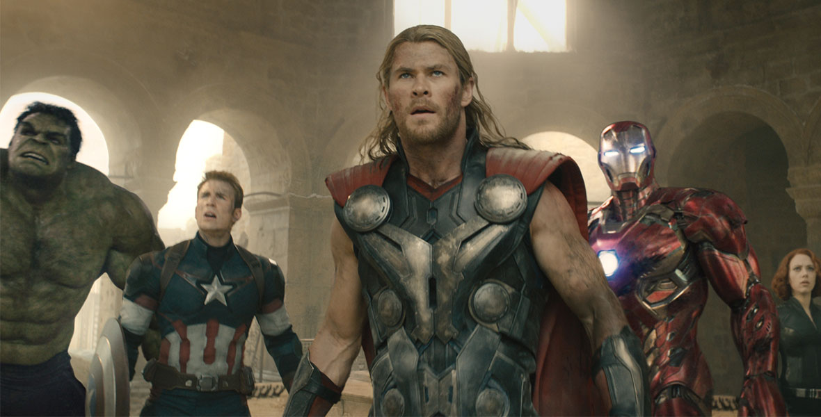 Thor stands in front of the Hulk and Captain America on his right and Iron Man, Black Widow, and Hawkeye on his left- each suited up in full armor.