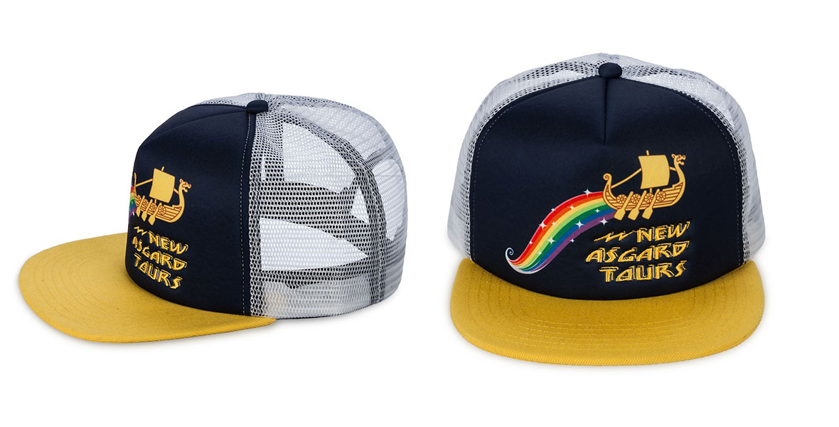 A navy and yellow trucker-style cap with the logo for “New Asgard Tours” on it. The logo features a Viking longboat with a dragon masthead with a rainbow trailing behind it.