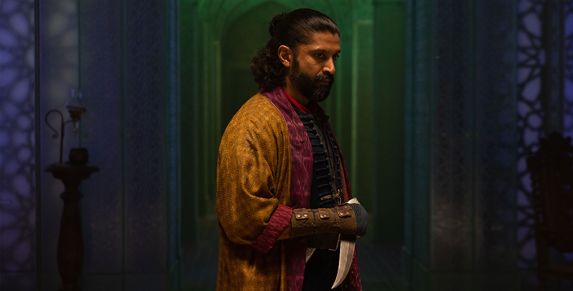 Waleed, played by Bollywood multi-hyphenate Farhan Akhtar, stands in profile, a dull, silver dagger in his gloved hands within the darkened sanctuary of the Red Dagger society.