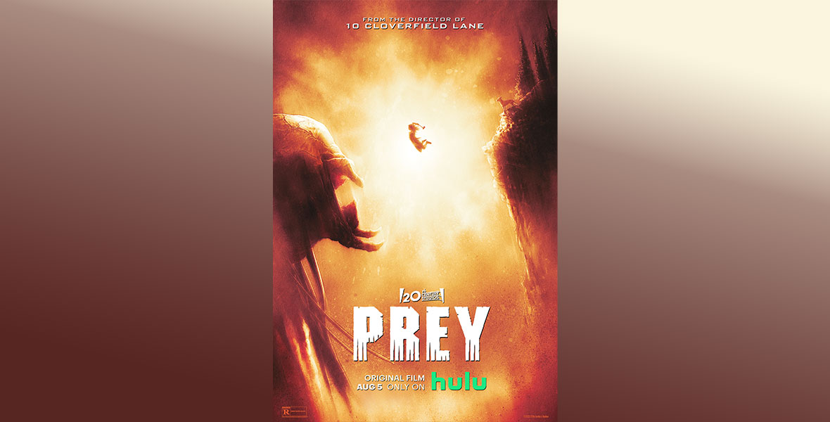 Poster for 20th Century Studios’ Prey. The entire poster is in hues or orange, yellow and brown and features a humongous predator on the right side. The monster has a large head, and its mouth is open wide. Coming at it from the right is a tiny woman flying through the air with an axe held above her head. On the far right is a mountain cliffside where a small dog can be seen on a ledge. The title logo is written in white font on the bottom of the poster.