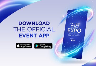 The screen of a smartphone with the text “D23 Expo The Ultimate Disney Fan Event Presented by Visa” in white on a deep blue background. The screen is surrounded by purple and blue sparkles. To the left of the screen is the blue text “Download the official event app” with buttons to download on the App and Google play stores. The image is framed in the upper left and lower right corners with more sparkles on a deep blue background.