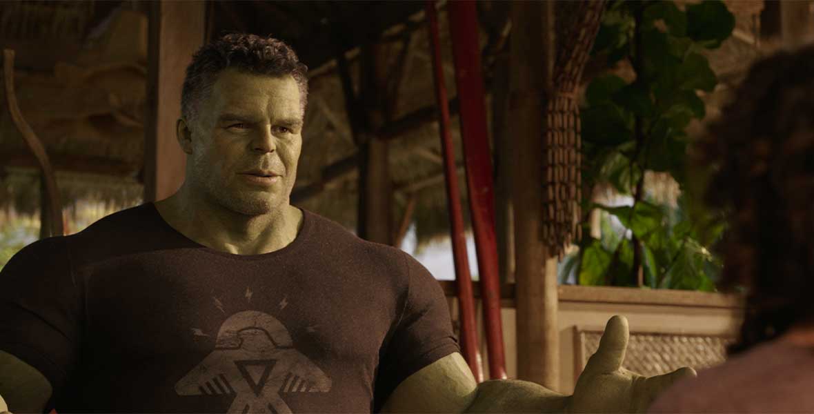 Actor Mark Ruffalo with CGI green skin and both arms extend outward.