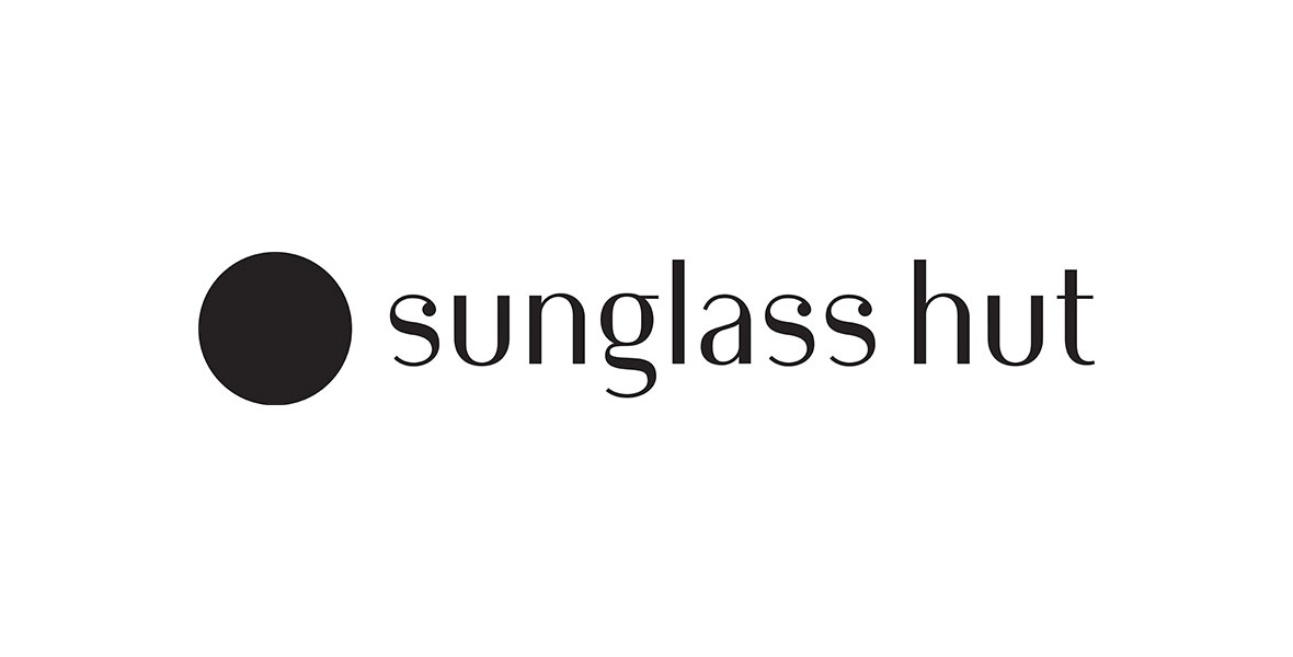 The logo for Sunglass Hut is seen with black lower-cased lettering with a large black circle featured before the name.