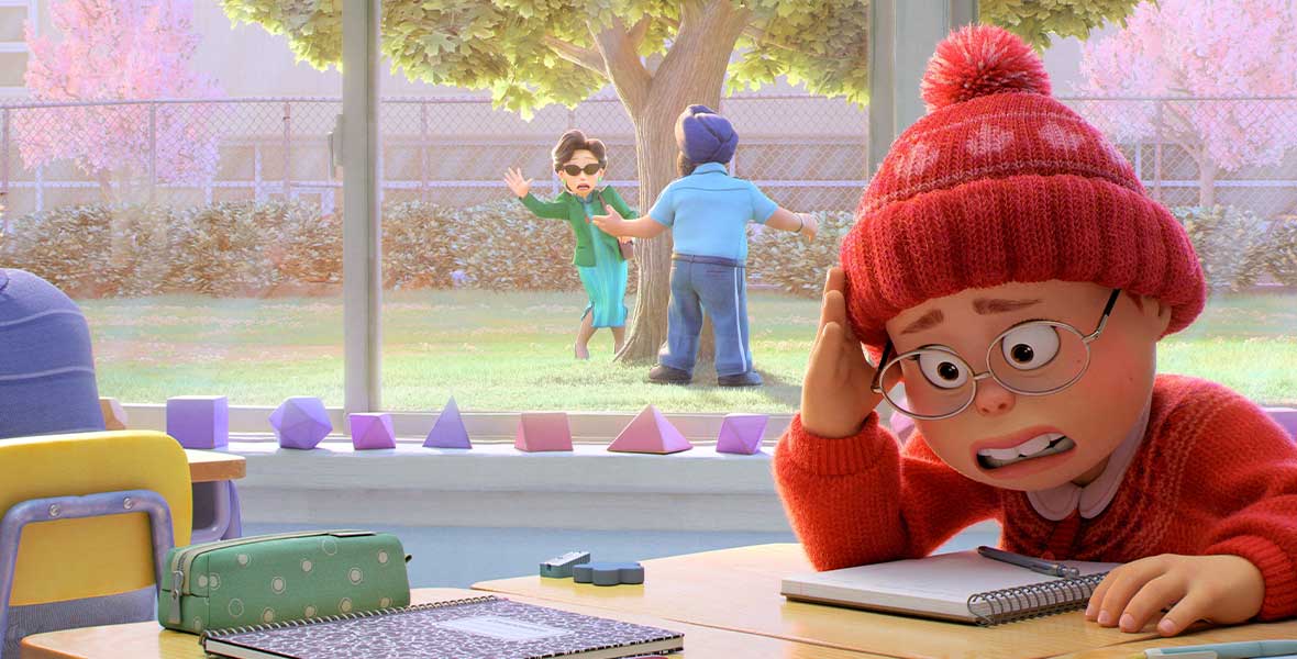 Animated character Mei Lee wears a red beanie with white maple leaves and red sweater. She has wiry glasses and is hiding her face with her right hand. She sits at a table with notebooks and assorted writing utensils. Behind her is a large window where her mother and a security guard are seen near a tree.