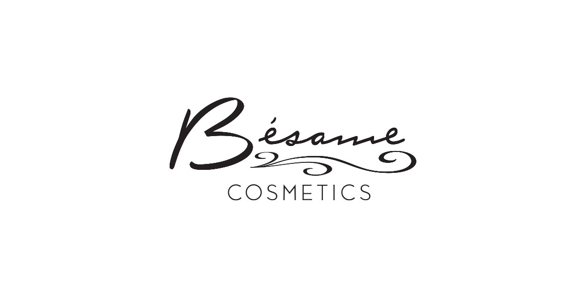 The official logo for Bésame Cosmetics, features “Bésame” in black script with a swirly design under it and “Cosmetics ” in all-caps.