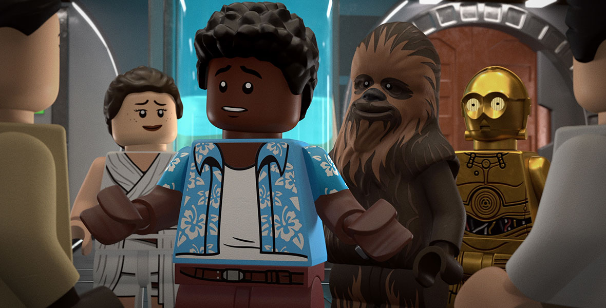 LEGO versions of Rey, Chewbacca, and C3PO gather around Finn