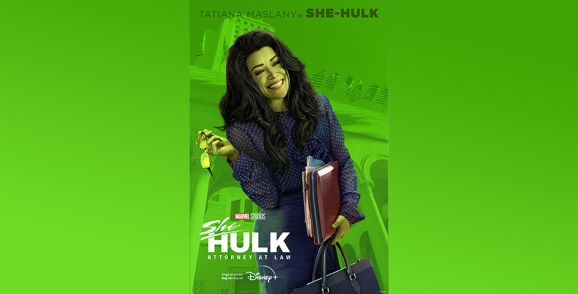 In this She-Hulk: Attorney at Law poster, She-Hulk is wearing a navy blue, long-sleeved shirt with white polka dots and a navy blue pencil skirt. She is carrying a briefcase and folders in one hand and glasses in the other. She is smiling off-camera.