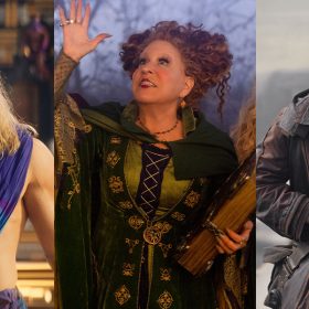 Thor, played by Chris Hemsworth, is shirtless and wearing a blue Grecian robe. Winifred Sanderson, played by Disney Legend Bette Midler, is wearing her green and purple dress and raising one hand in the air, and in the other hand, she holds her magical book of specials. Cassian Andor, played by Diego Luna, walks with purpose.