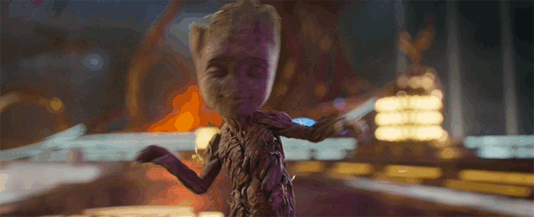 A gif of Baby Groot dancing. His eyes are closed as if he’s experiencing pure bliss and he swings his tiny arms around from side to side. Behind him, a body hurtles towards him and the camera, but he doesn’t see or hear it coming.