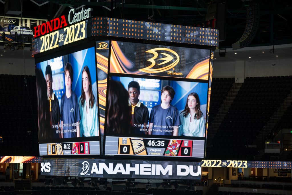 Video board at Honda Center in Anaheim, California shows the cast from The Mighty Ducks: Game Changers.
