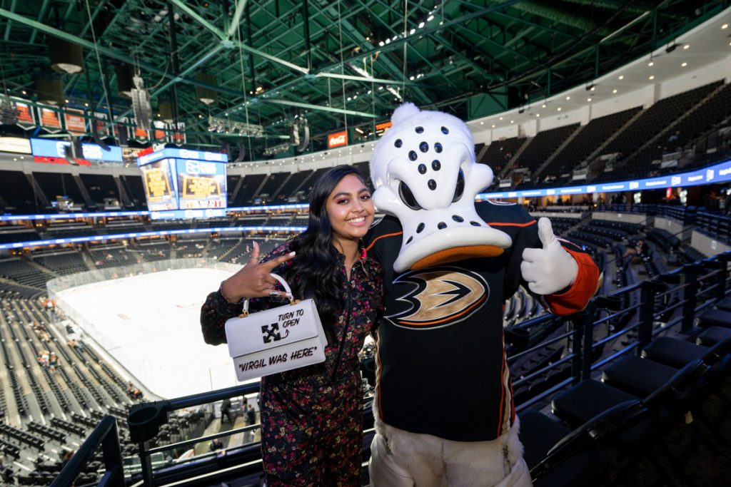 Actor Swayam Bhatia poses with Wild Wing, a duck mascot for professional hockey team Anaheim Ducks.