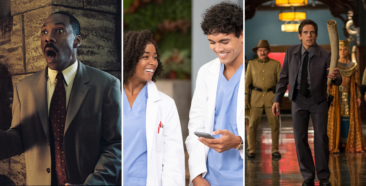 Actor Eddie Murphy holds torch in his right hand. He stands in a dark hallway with his mouth agape. He wears a gray suit with a white, button-down shirt, and red tie. Actors Alexis Floyd and Niko Terho smile and stand side by side. Floyd and Terho both wear blue scrubs and white lab coats with multi-colored pens in the pocket. Terho holds a silver cell phone in his left hand and looks down. Behind them is a light blue painted wall and cubicles. Actor Ben Stiller holds a large ivory tusk in his left hand. He wears a dark gray jacket and matching pants with a black tie and charcoal button-down shirt. He stands in a dimly lit hallway with a row of lighting fixtures hanging from the ceiling.