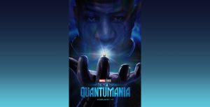 The blue-hued face of actor Jonathan Majors, portraying Marvel villain Kang, fills most of the new poster for Marvel Studios’ Ant-Man and The Wasp: Quantumania. Majors has his gloved hand outstretched, and two tiny figures are standing on one of his fingers. He is looking down at them, and there is a bright light coming from behind them. The logos for both the film and for Marvel Studios are seen at the bottom of the image, as well as the words “February 17.”