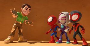 From left to right, an animated man wears brown pants, brown shoes, and a green, short-sleeved shirt. He looks and leans to his left where Team Spidey stands. Team Spidey—Peter Parker, Gwen Stacy, and Miles Morales—all wear their spider-themed super hero costumes and look up at the man.