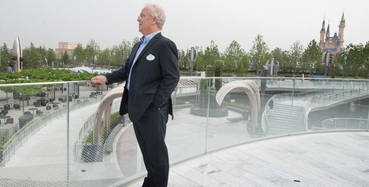 Bob Weis stands on a terrace overlooking the Gardens of Imagination and the Enchanted Storybook Castle at Shanghai Disney Resort in 2016.