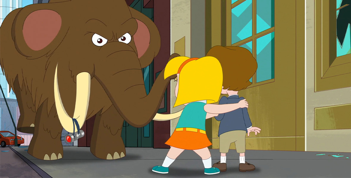 In a scene from the Disney Channel animated series Hamster & Gretel, a young girl and boy stand side by side facing an enormous brown woolly mammoth. She wears a turquoise sleeveless shirt, orange headband, orange skirt, yellow belt, and turquoise shoes. He wears a blue long-sleeve shirt, khaki shorts, and brown shoes. They stand in a room with large glass windows that extend toward the ceiling.