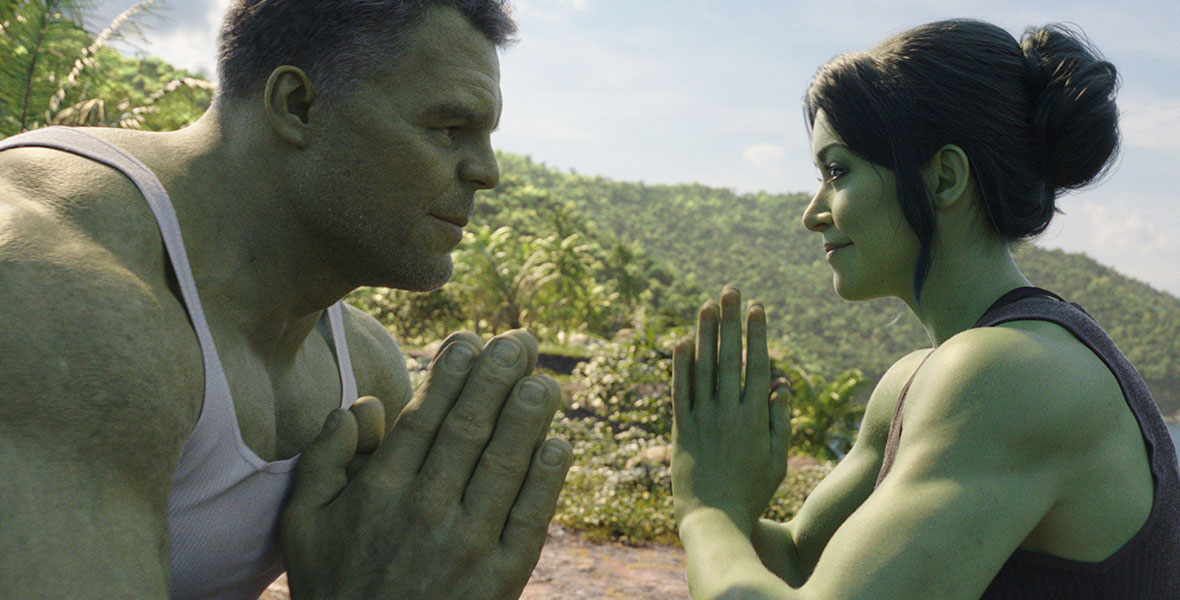 Bruce Banner and Jennifer Walters are looking eye-to-eye with their hands in the praying stance in front of them. They are both in their hulk forms.