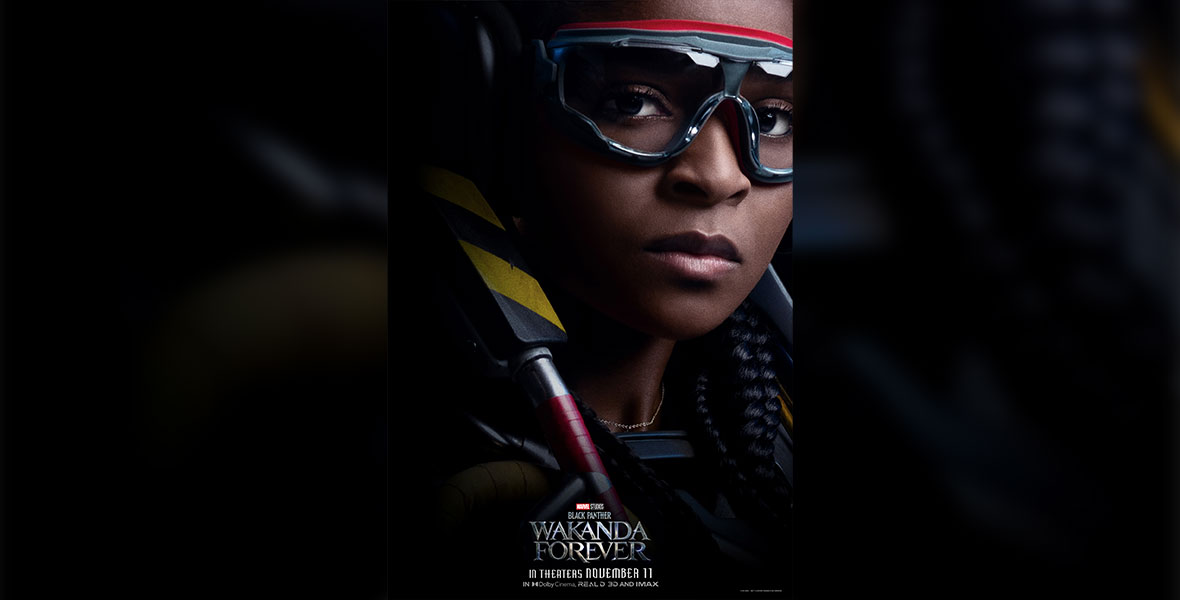 A close-up portrait of Riri Williams (Dominique Thorne), wearing goggles and a gold necklace. She is half-shadowed, as if she is emerging from the darkness.