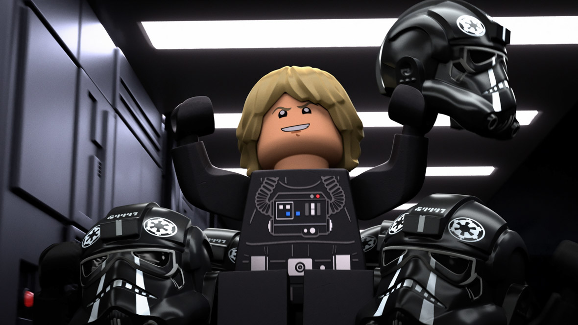 In this scene from LEGO Star Wars Terrifying Tales, a LEGO version of Luke Skywalker raises his fists in the air. He is in disguise, wearing a Death trooper uniform.