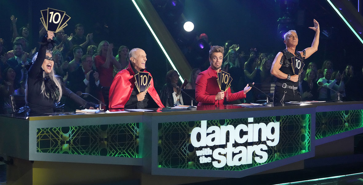 Judges Carrie Ann Inaba, Len Goodman, Derek Hough, and Bruno Tonioli hold 10 cards up on “Halloween Night” of Dancing with the Stars.