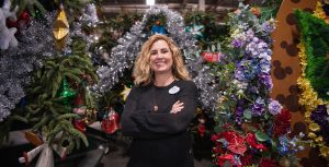 Dawn Pipal-Keehne, Resort Enhancement Area Manager for Disneyland Resort, stands among a bounty of Christmas decorations in the Resort Enhancement warehouse in Anaheim, California.