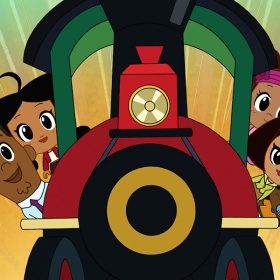 In a still from Chibi Tiny Tales, animated characters Oscar and Penny hang their heads outside of the right side of a train while BeBe, Trudy, and CeCe Proud hang their heads on the left side of a train. The train is red, green, black, and gold. The background is gold with green radiating upward.