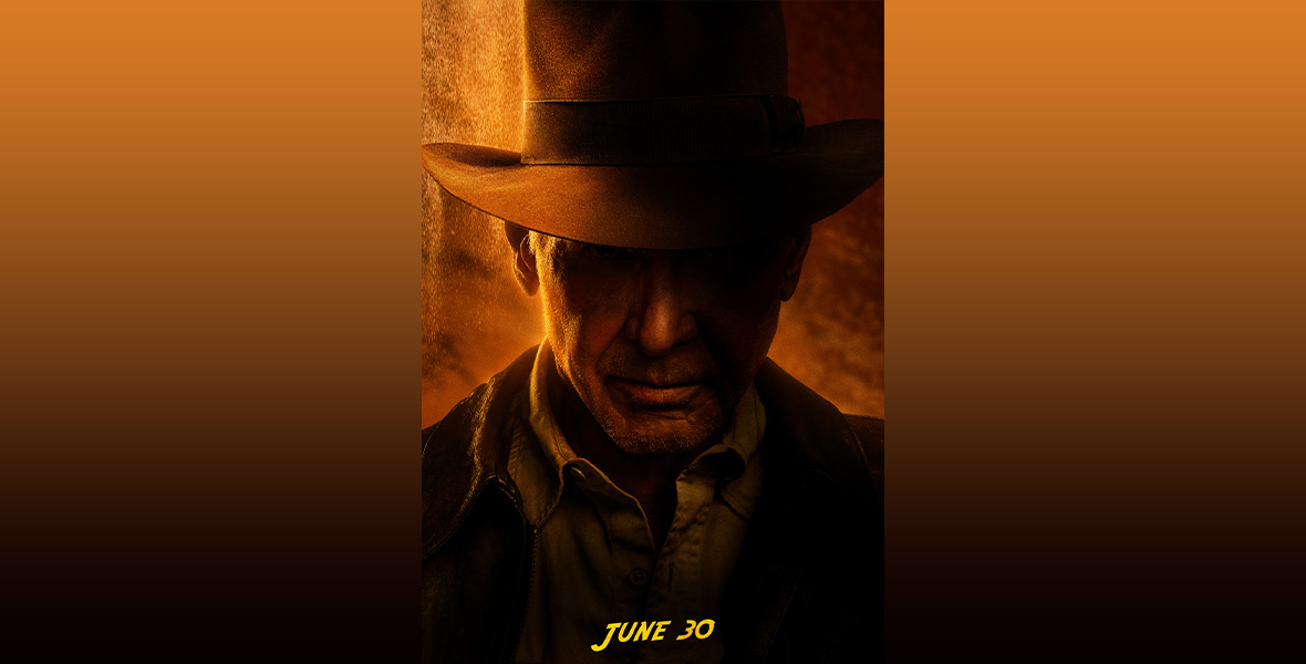 A promotional image for Lucasfilm’s Indiana Jones and the Dial of Destiny. Harrison Ford as Indiana Jones is seen in shadowy silhouette with his signature fedora, against a golden-brown stone-line background. The words “June 30” are seen at the bottom of the image in the iconic Indiana Jones font.