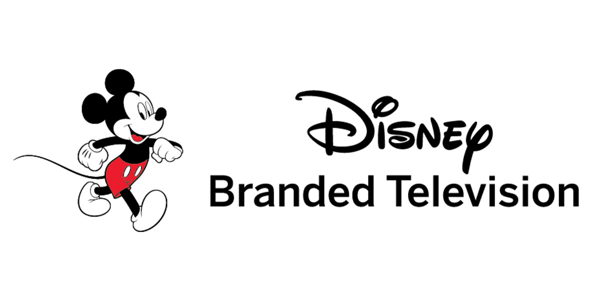 The logo for Disney Branded Television; the words “Disney Branded Television” are in black against a white background, with an image of Mickey Mouse to the left. He’s wearing red shorts.