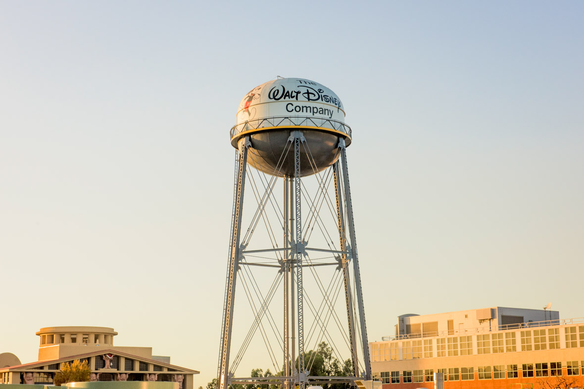 The water tower for The Walt Disney Company, featuring Mickey Mouse. In the background, you can see the Team Disney Building featuring columns designed as the seven dwarfs from Snow White and the Seven Dwarfs.