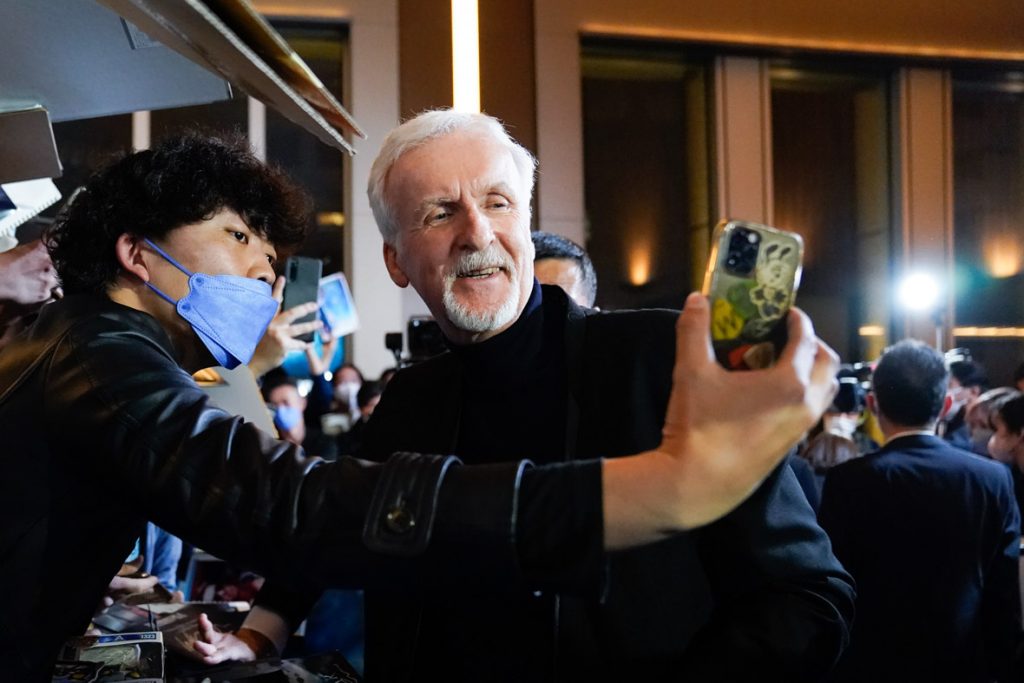TOKYO, JAPAN - DECEMBER 10: James Cameron takes a selfie with a fan during the "Avatar: The Way of Water" Japan Premiere at TOHO Cinemas Hibiya on December 10, 2022 in Tokyo, Japan. (Photo by Christopher Jue/Getty Images for Disney)