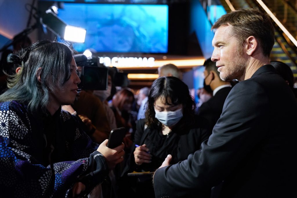 TOKYO, JAPAN - DECEMBER 10: Sam Worthington greets fans during the "Avatar: The Way of Water" Japan Premiere at TOHO Cinemas Hibiya on December 10, 2022 in Tokyo, Japan. (Photo by Christopher Jue/Getty Images for Disney)