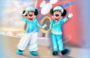 In a concept art image from Disney Cruise Line, Captain Minnie Mouse and Captain Mickey Mouse are seen in their new Silver Anniversary at Sea ensembles—Minnie (on left) in a turquoise jacket, white pants, and turquoise shoes (with a captain’s hat), and Mickey (on right) in a turquoise jacket and pants (with a captain’s hat). Part of a Disney Cruise Line ship, as well as some sky, is seen behind them.