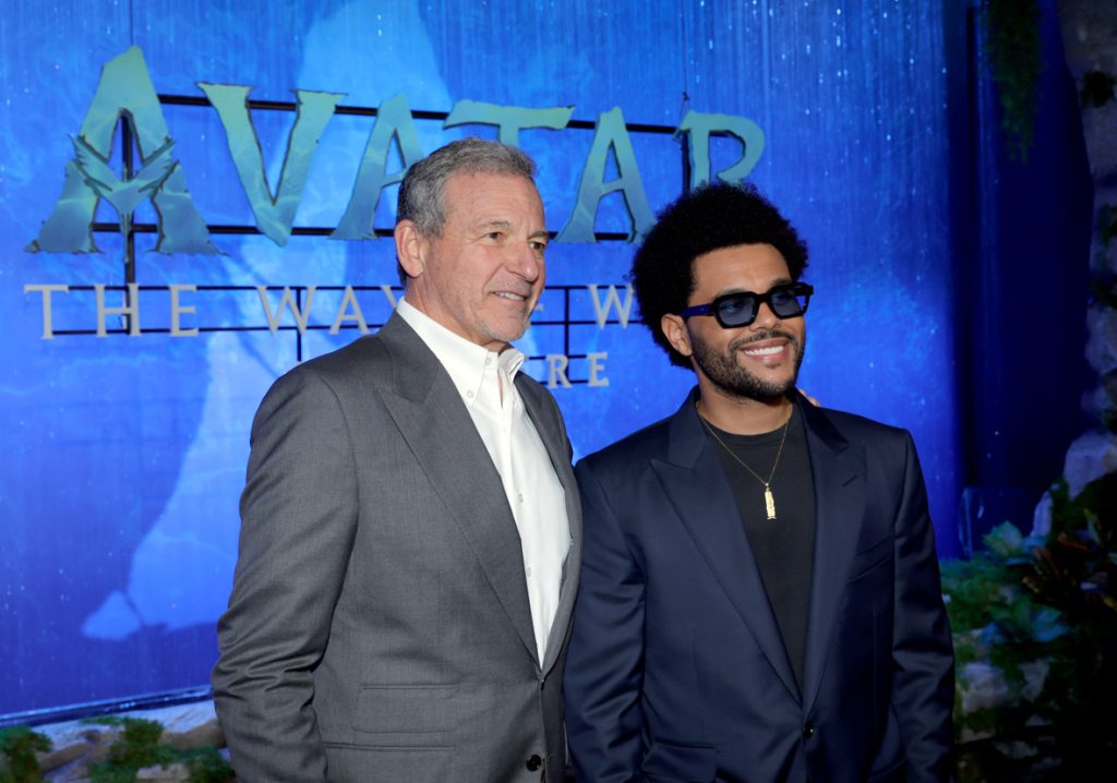 HOLLYWOOD, CALIFORNIA - DECEMBER 12: (L-R) Bob Iger, CEO, Walt Disney Company, and The Weeknd attends the U.S. Premiere of 20th Century Studios' "Avatar:  The Way of Water" at the Dolby Theatre in Hollywood, California on December 12, 2022. (Photo by Rich Polk/Getty Images for 20th Century Studios)