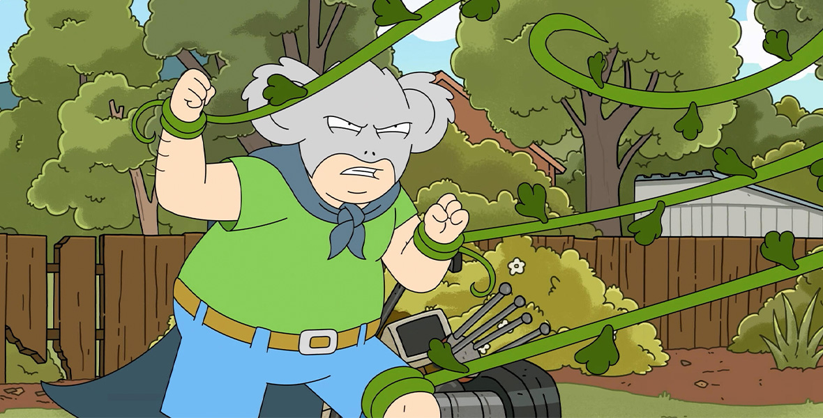 In a scene from the Hulu animated series Koala Man, a man wears a koala mask; a blue blanket as a cape; a green, short-sleeved T-shirt; and blue jean shorts. He’s in a backyard fighting long green vines.