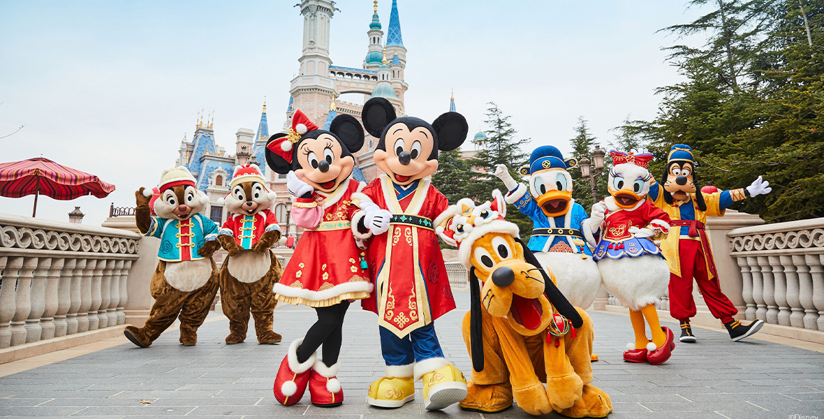 Mickey Mouse, Minnie Mouse, Chip and Dale, Pluto, Donald Duck, Daisy Duck, and Goofy are all seen wearing their Spring Festival finest and standing in front of Enchanted Storybook Castle at Shanghai Disneyland, celebrating the Year of the Rabbit at Shanghai Disney Resort.