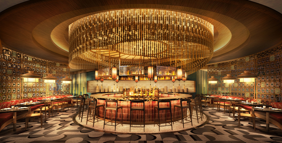 Concept art of the upcoming Din Tai Fung restaurant coming to Downtown Disney. It features a round bar at the center of the restaurant under a beautiful, beaded centerpiece hanging from the ceiling. Individual tables and booth surround the bar and the entire restaurant is bathed in gold lighting.
