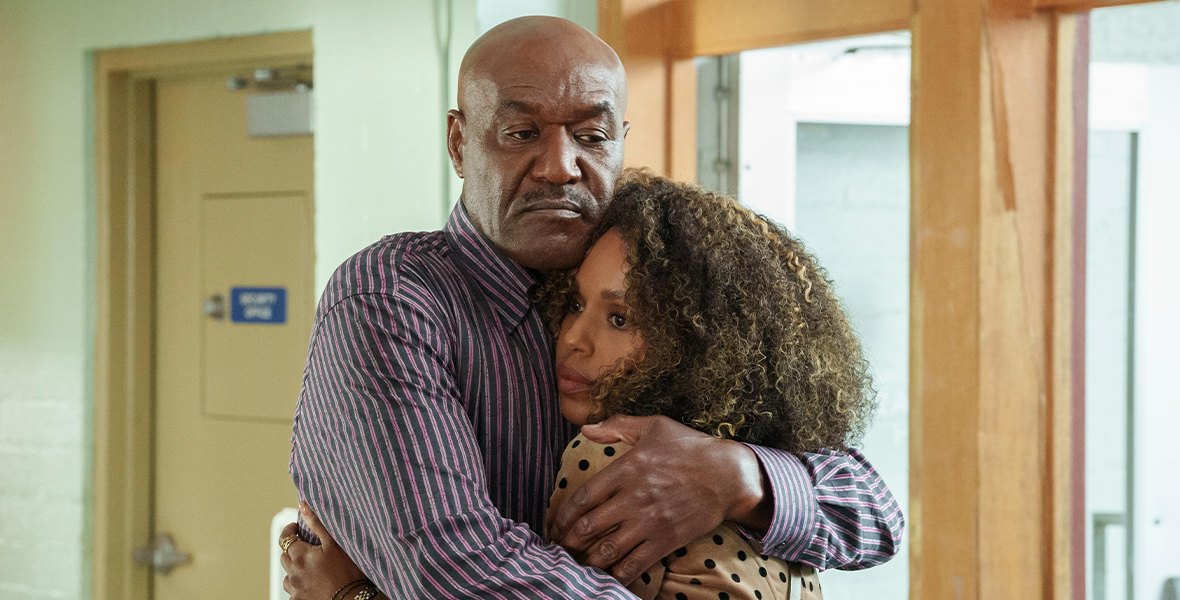 In a scene from series UnPrisoned, actors Kerry Washington and Delroy Lindo hug.