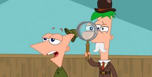 Phineas and Ferb stand side-by-side as Phineas talks while Ferb looks through a handheld magnifying glass. Phineas wears a hat and jacket reminiscent of Sherlock Holmes. A flared top hat sits on Ferb’s green hair, and he wears a white mustache and a red tie.