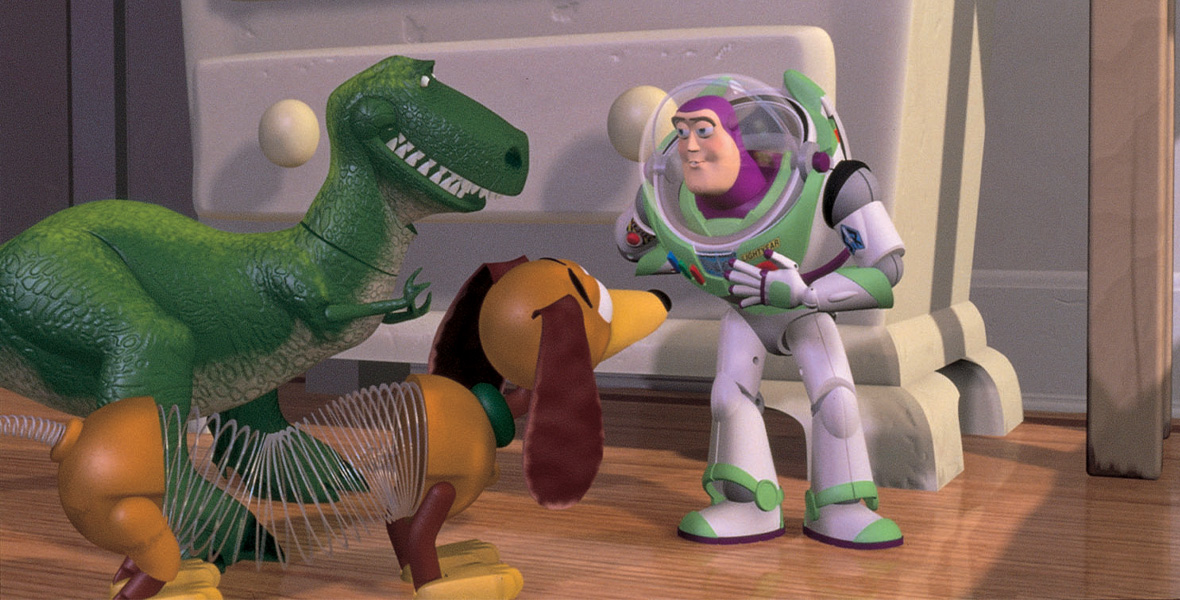 In a scene from Toy Story, animated toys Rex, a green T-Rex, and Slinky Dog, a coiled body with floppy ears, and a green collar, talk to Buzz Lightyear, a spaceman action figure.