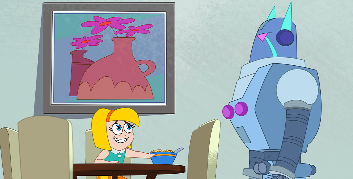 In a scene from Hamster & Gretel, Gretel, an animated young girl, sits at a kitchen table and stares at a large robot. She wears an orange headband, a teal sleeveless top, and an orange skirt.