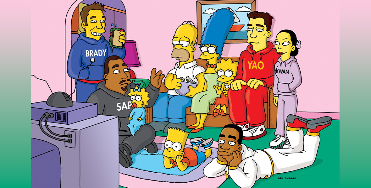 In a scene from an episode of The Simpsons, animated family Homer, Marge, and Lisa Simpson sit on a brown coach next to an animated version of Yao Ming and look at the TV directly across from the couch. Animated versions of Michelle Kwan, Warren Sapp, and LeBron James sit on the ground next to Maggie and Bart Simpson, while Tom Brady stands and holds a sandwich.